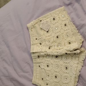 free people white jean shorts with beads and patterns NWT size 24